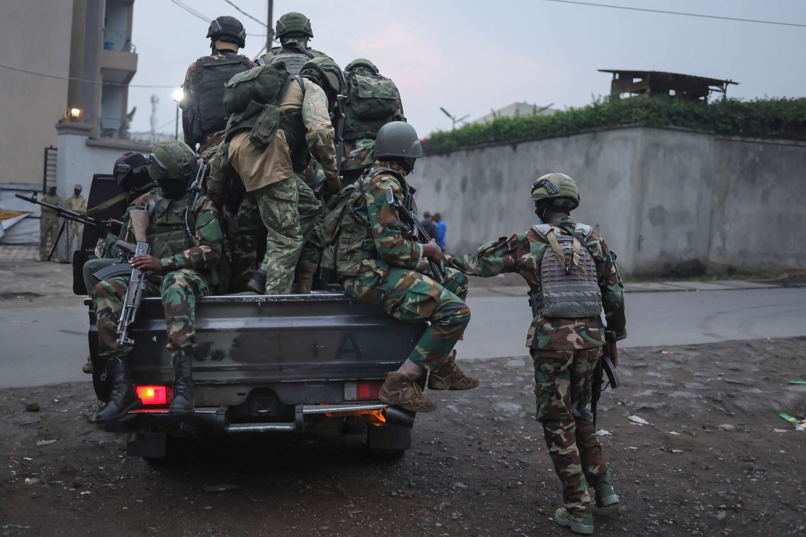 Members of the M23 armed group board a pickup truck as they leave to carry out a patrol from their position in Goma on January 29, 2025. Rwanda-backed fighters controlled almost all of the DR Congo city of Goma on January 29, 2025 where residents were re-emerging after days of deadly fighting and Angola urged leaders of both countries to urgently hold peace talks. After intense fighting that saw the M23 armed group and Rwandan troops seize the city's airport and key sites, calm returned to the mineral trading hub. (Photo by AFP) (Photo by -/AFP via Getty Images)