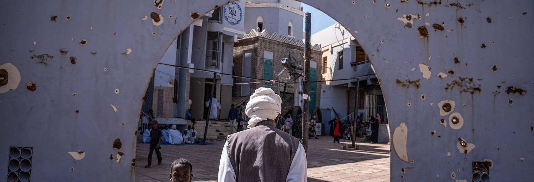 Image showing a man walks into the courtyard of a war-torn mosque in Omdourman on November 1, 2024. 