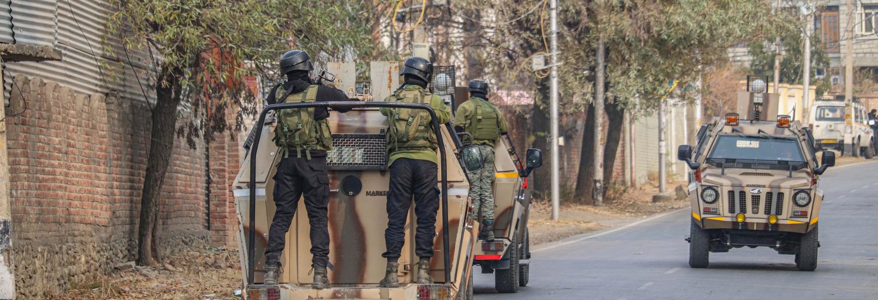 Indian security personnel patrol on armored vehicles near the site of a gun battle between militants and security forces on the outskirts of Srinagar, Jammu and Kashmir, on December 3, 2024. Police say one militant is killed in the gun battle.