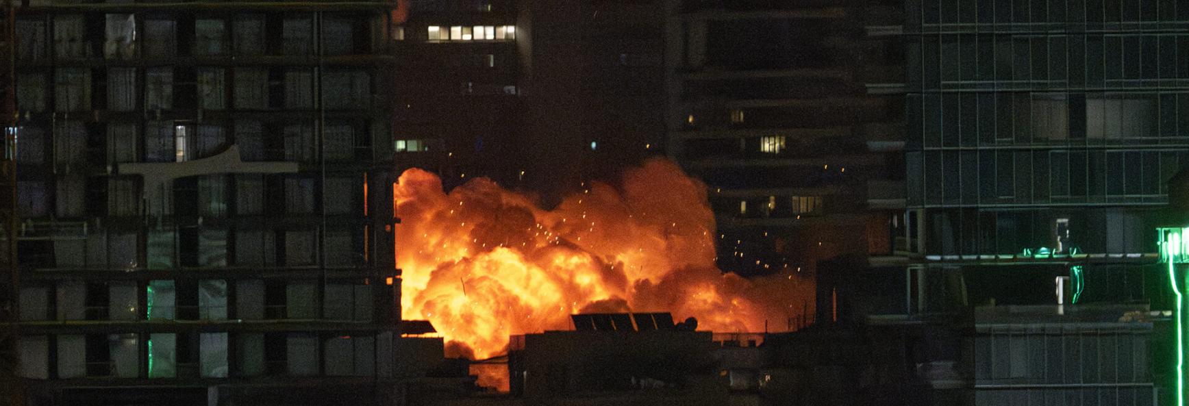 Smoke and flame rise after Iranian strikes hit a building as Iran's ongoing retaliatory attacks with ballistic missiles towards Israel are seen from Tel Aviv on 16 June 2025.