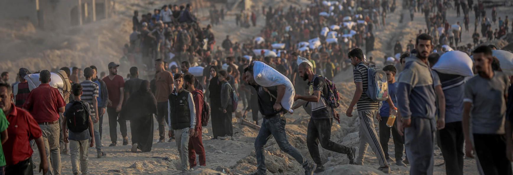 Palestinians flock to the aid center set up by the US and Israeli-led Gaza Humanitarian Relief Foundation on the Coastal Road in the Sudaniya area to receive food package in northern Gaza City, Gaza on 17 June 2025. 
