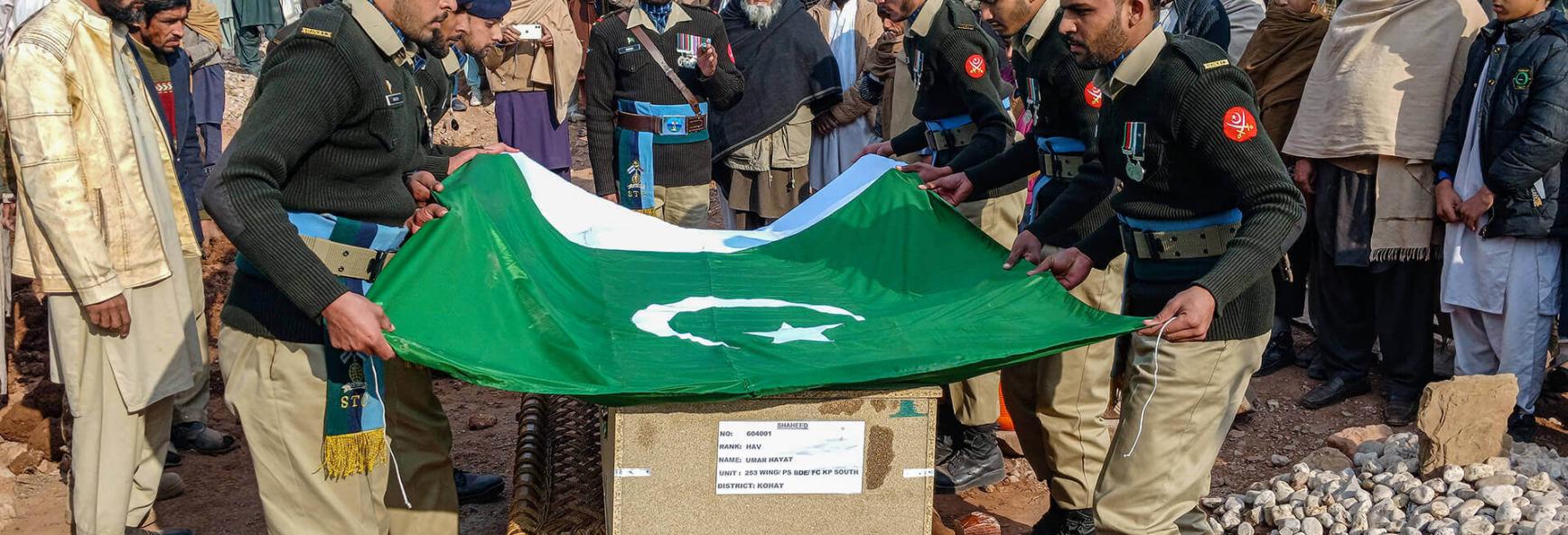 Pakistan’s army personnel take part in a funeral ceremony of a soldier killed in an attack in the Makeen area of Khyber Pakhtunkhwa province on 22 December 2024.