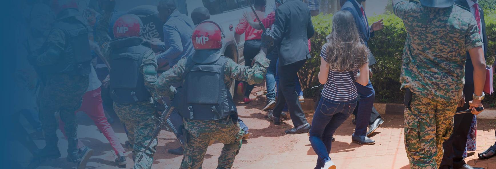 Supporters of Uganda opposition leader Robert Kyagulanyi, also known as Bobi Wine, and local and foreign journalists are assaulted by Uganda Military Police outside the UN Human RIghts offices on February 17, 2021