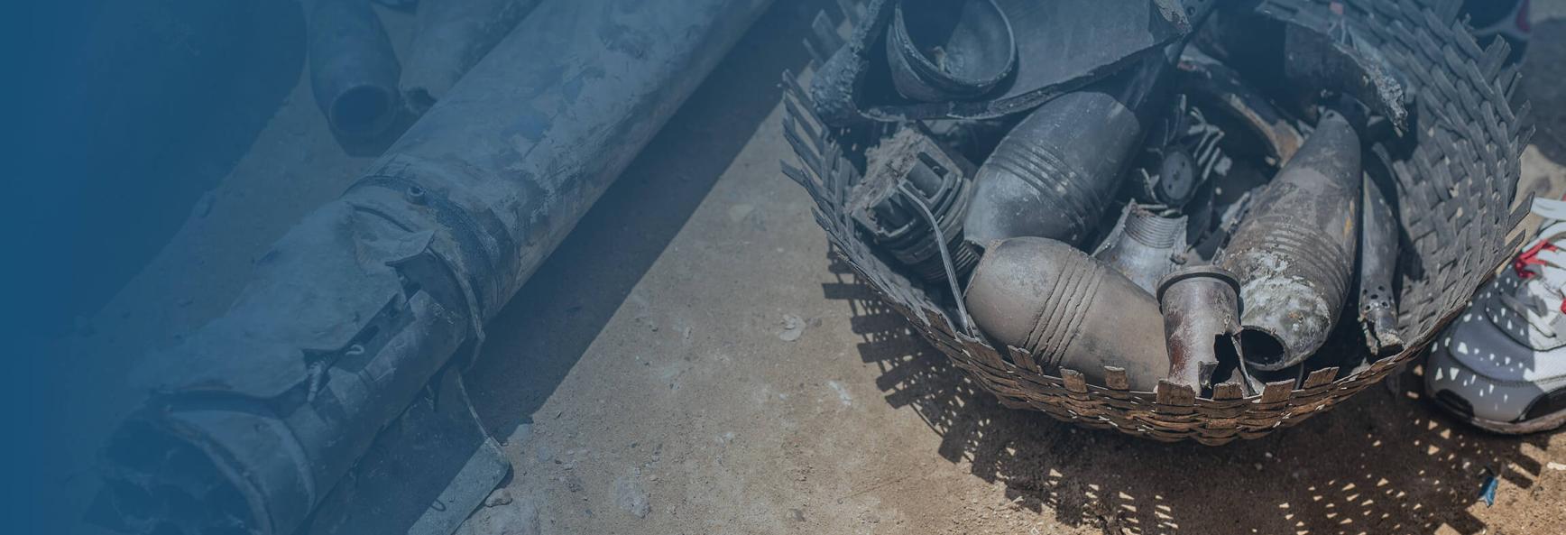Shrapnel and remnants of munitions that damaged a school lie on the ground after being gathered by residents following explosions after a fire at a military arsenal in the Musaga district of Bujumbura, on April 1, 2026.