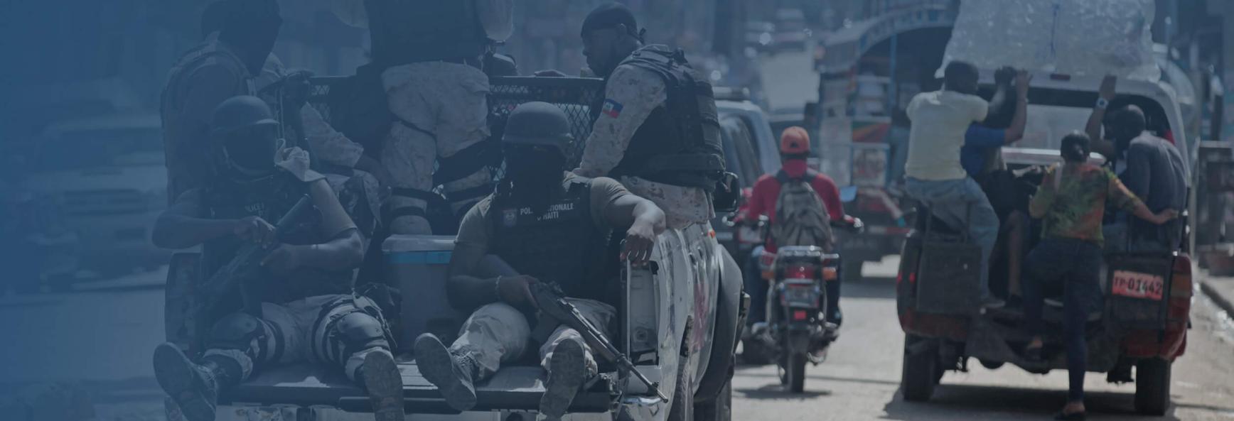 Haitian national police officers patrol a street of Port-au-Prince, Haiti, November 16, 2016.