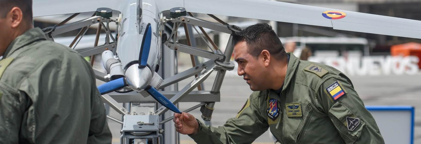 Colombian military personnel set up a drone during Feria Aeronautica Internacional 2019 &mdash;  Colombia's international aeronautical fair &mdash; at Jos&eacute; Mar&iacute;a C&oacute;rdova International Airport in Rionegro, Colombia, on 11 July 2019. Photo by Staff Sgt. Megan Floyd/US Air National Guard photo