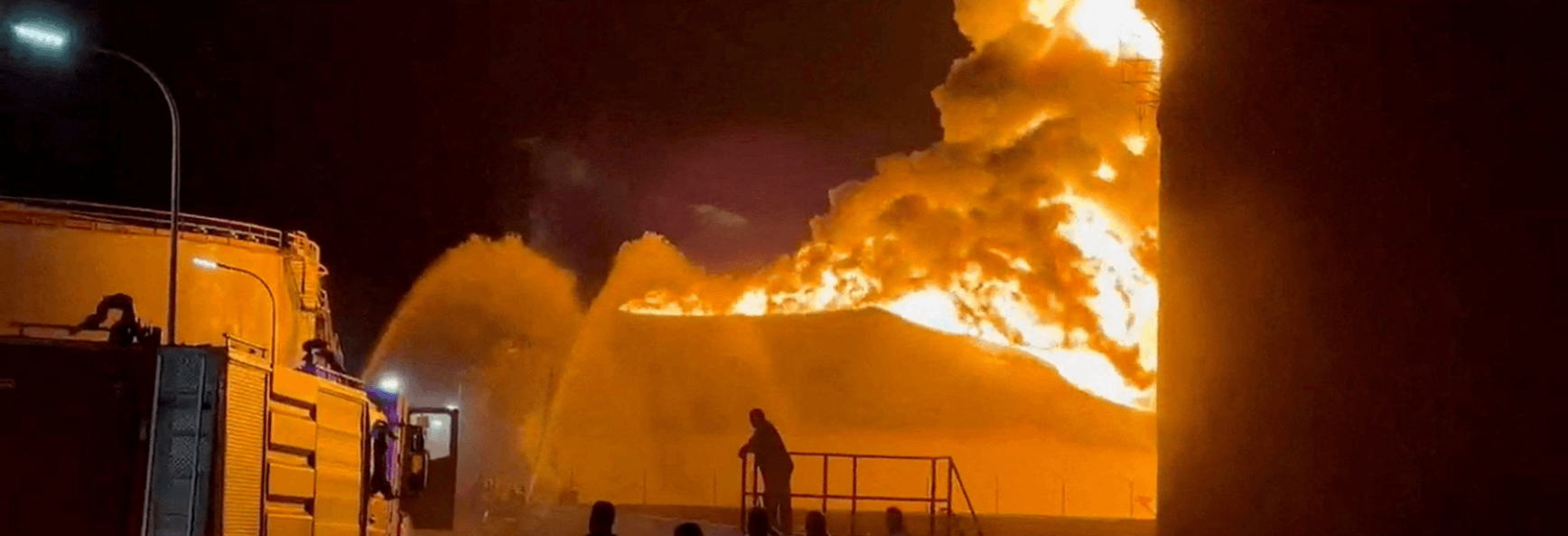 A fire at an oil refinery in Zawiya, Libya, rages as firefighters work to control the blaze on 11 August 2026. 