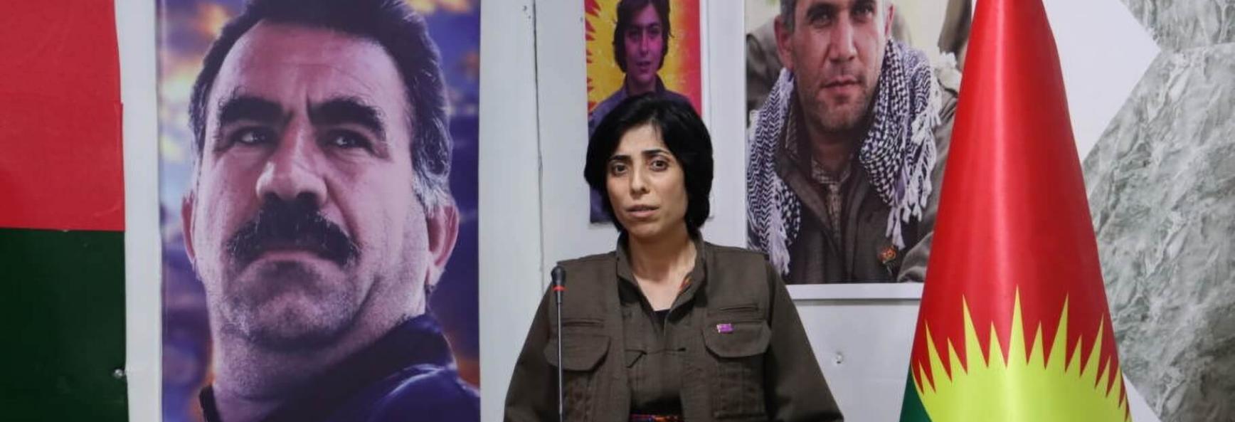 Peyman Viyan, co-chair of the PJAK, at the group&rsquo;s 7th Congress, with a portrait of PKK founder Abdullah &Ouml;calan in the background. 