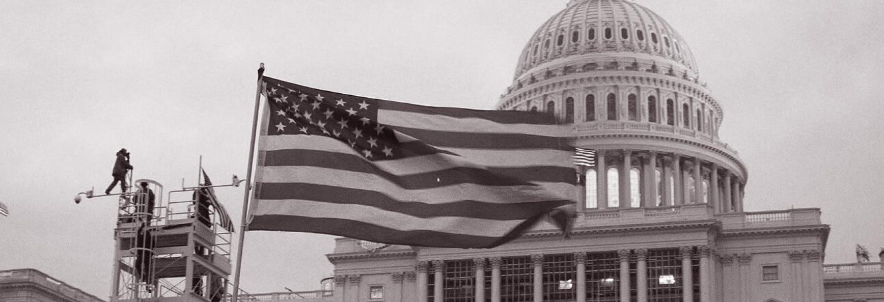 United_States_Capitol_outside_protesters_with_US_flag_20210106-copy-1-1.jpg
