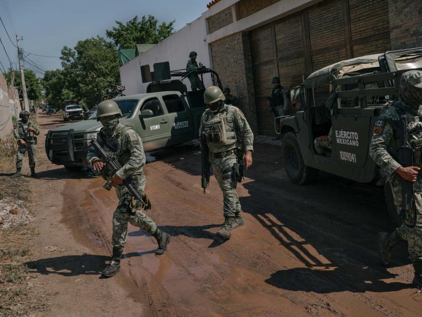 CULIACAN, SINALOA, MEXICO, October 22, 2024: Members of the military arrive at a scene where a key mid-level operator for Ismael "El Mayo" Zambada was captured following a fierce battle between the military and civilians, leaving 19 civilians dead. 
