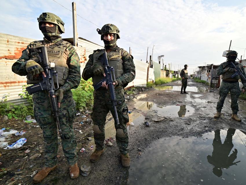 Ecuadorean security forces stand guard during the so-called Tormenta 22 operation, in which several houses used by organised crime gangs to keep kidnap victims isolated were destroyed, in Duran, Ecuador, on March 14, 2025. 