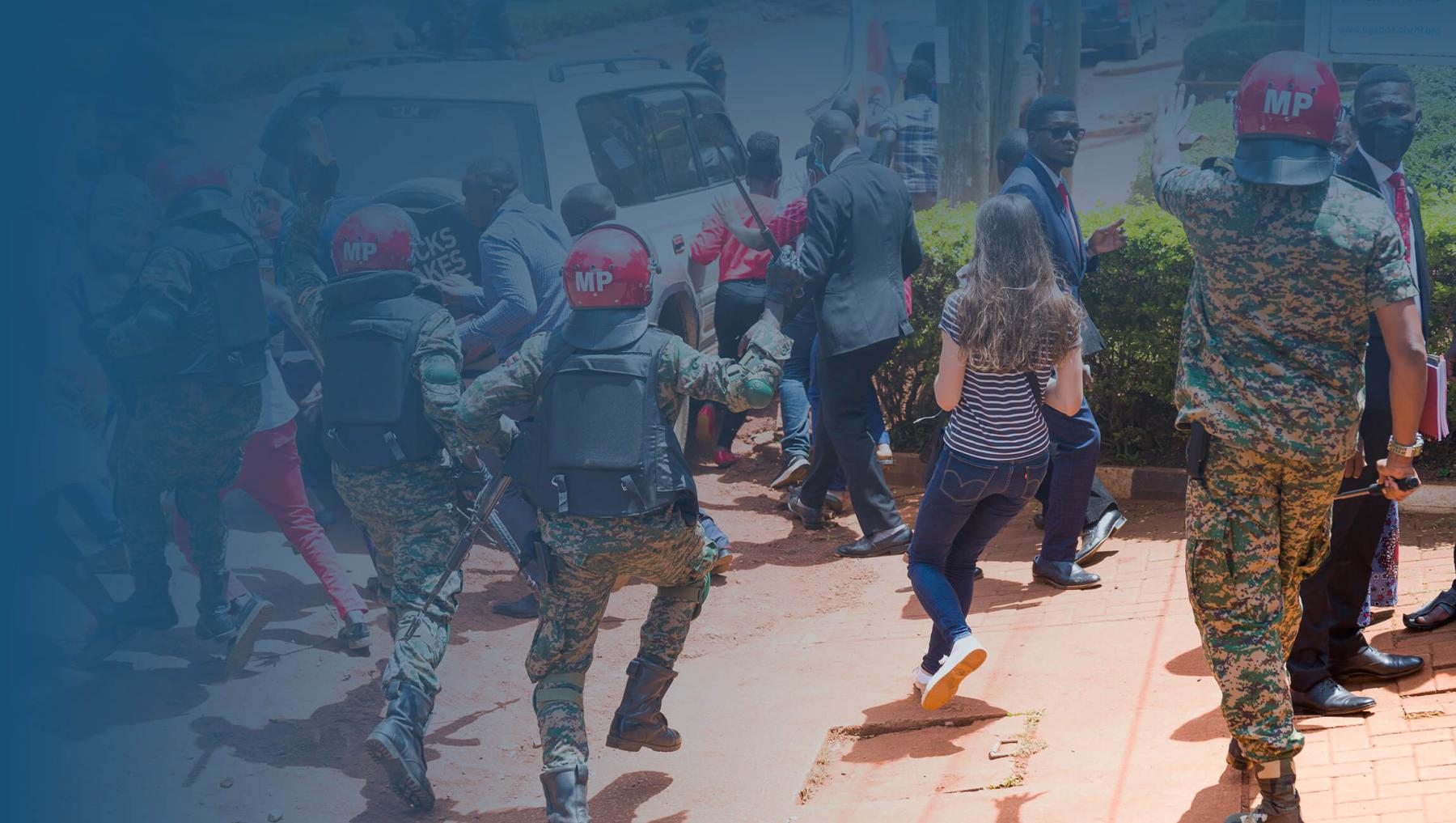 Supporters of Uganda opposition leader Robert Kyagulanyi, also known as Bobi Wine, and local and foreign journalists are assaulted by Uganda Military Police outside the UN Human RIghts offices on February 17, 2021