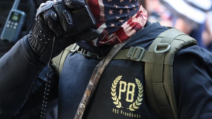 Proud Boys member using a walkie-talkie