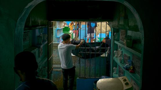 Family members and members of the Catholic church exhume the remains of victims of government extrajudicial killings ahead of International Human Rights Day, on December 7, 2021 inside a public cemetery in the suburbs of Manila, Philippines. 
