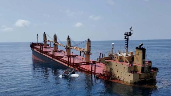 This handout photo provided by Yemeni Al-Joumhouria TV, shows the British-registered cargo ship 'Rubymar' sinking, after it was targeted by Yemen's Houthi forces in international waters in the Red Sea, on March 3, 2024, in the Red Sea. 