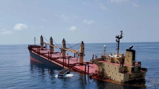 This handout photo provided by Yemeni Al-Joumhouria TV, shows the British-registered cargo ship 'Rubymar' sinking, after it was targeted by Yemen's Houthi forces in international waters in the Red Sea, on March 3, 2024, in the Red Sea. 