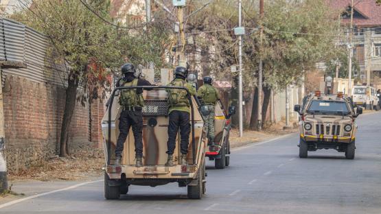 Indian security personnel patrol on armored vehicles near the site of a gun battle between militants and security forces on the outskirts of Srinagar, Jammu and Kashmir, on December 3, 2024. Police say one militant is killed in the gun battle.