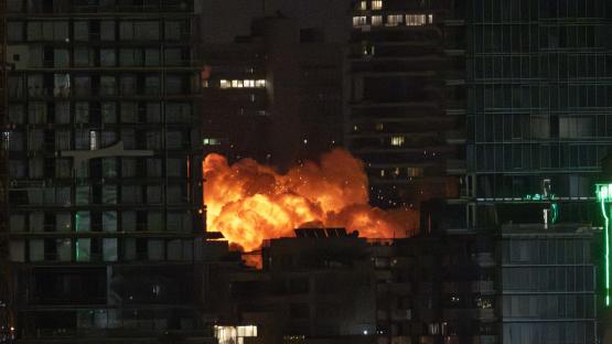 TEL AVIV, ISRAEL - JUNE 16: Smoke and flame rise after Iranian strikes hit a building as Iran's ongoing retaliatory attacks with ballistic missiles towards Israel are seen from Tel Aviv, Israel on June 16, 2025.