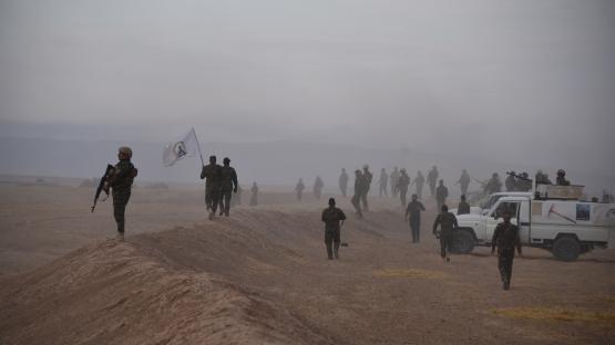 A joint force of the Iraqi army and Popular Mobilization Forces paramilitaries patrols an area in the Qayyara region in Iraq&rsquo;s northern Nineveh province during a security operation to search for reported remnants of the Islamic State on 31 October 2024. Photo by Zaid al-Obeidi/AFP via Getty Images 