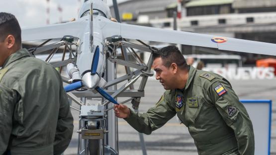 Colombian military personnel set up a drone during Feria Aeronautica Internacional 2019 &mdash;  Colombia's international aeronautical fair &mdash; at Jos&eacute; Mar&iacute;a C&oacute;rdova International Airport in Rionegro, Colombia, on 11 July 2019. Photo by Staff Sgt. Megan Floyd/US Air National Guard photo