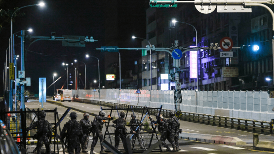 Photo - Taiwanese Military Police personnel install road blockades during a drill as part of the annual Han Kuang military exercises in Taipei, Taiwan, 12 August 2026. 