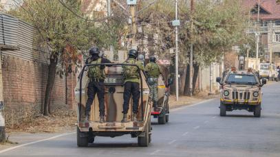 Indian security personnel patrol on armored vehicles near the site of a gun battle between militants and security forces on the outskirts of Srinagar, Jammu and Kashmir, on December 3, 2024. Police say one militant is killed in the gun battle.
