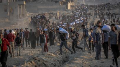 Palestinians flock to the aid center set up by the US and Israeli-led Gaza Humanitarian Relief Foundation on the Coastal Road in the Sudaniya area to receive food package in northern Gaza City, Gaza on 17 June 2025. 