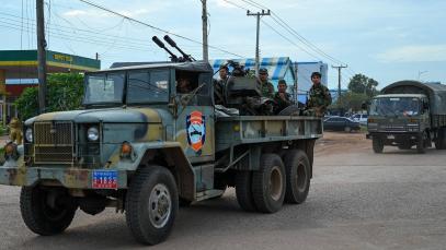 Cambodian soldiers stand on a military truck with an anti-aircraft gun in Oddar Meanchey province on 25 July 2025. 