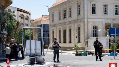 A cordoned-off area and a damaged structure in the aftermath of explosions near a hotel where French President Emmanuel Macron was meant to be staying in Damascus, Syria, 7 July 2026.