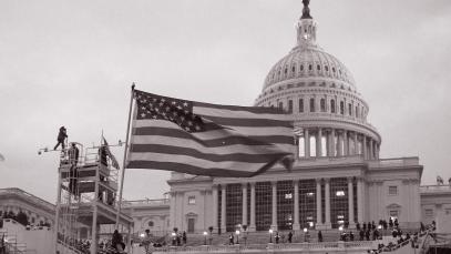 United_States_Capitol_outside_protesters_with_US_flag_20210106-copy-1-1.jpg