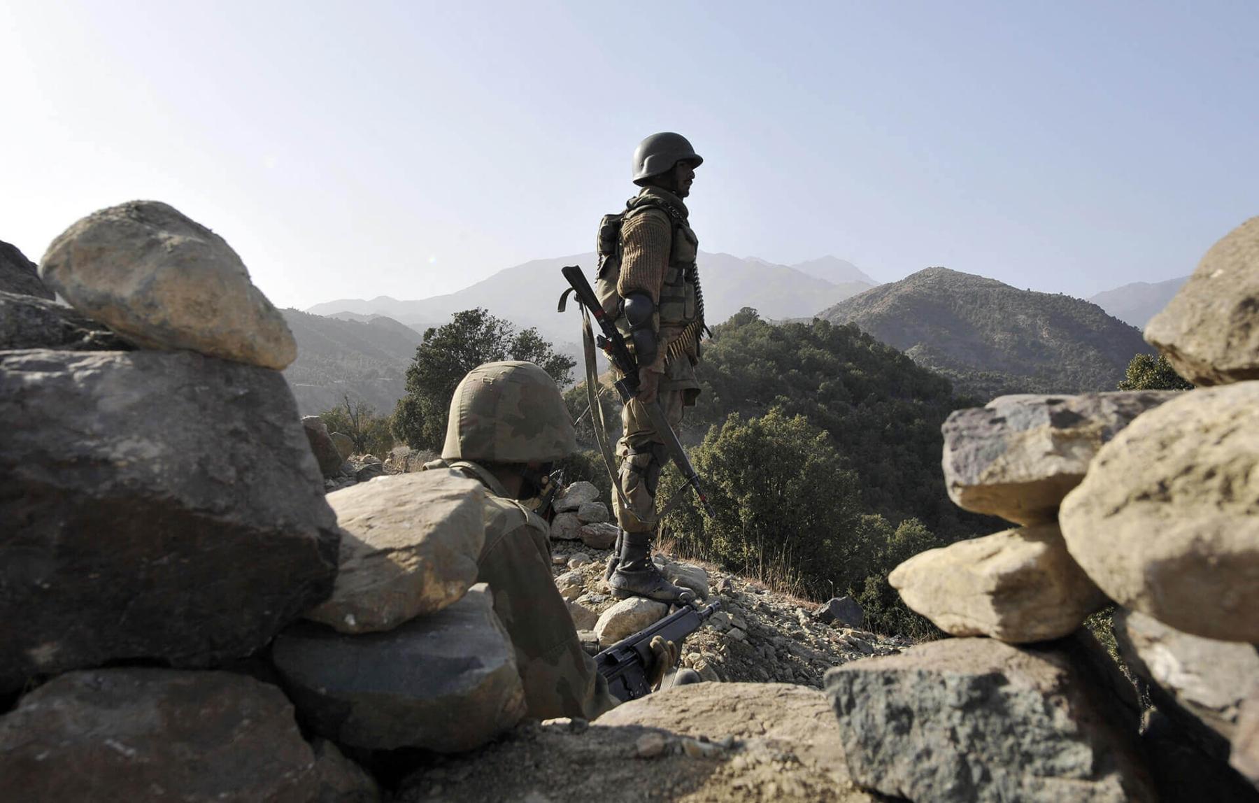 Pakistani soldiers are pictured on 17 November 2009, standing guard in Ladha town, which was the stronghold of Taliban militants in South Waziristan. 