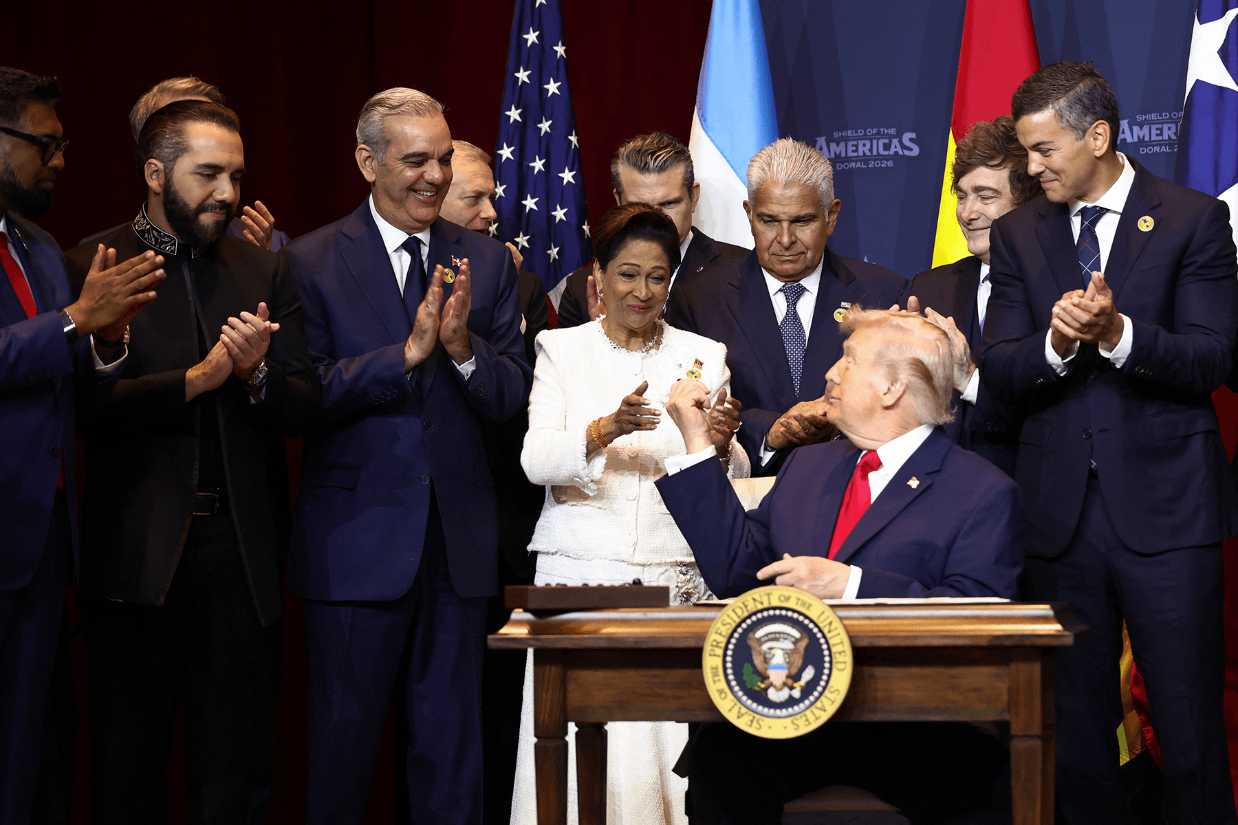 President Donald Trump signs the &ldquo;Commitment to Countering Cartel Criminal Activity&rdquo; document during the Shield of the Americas Summit in Miami, Florida, on 7 March 2026.